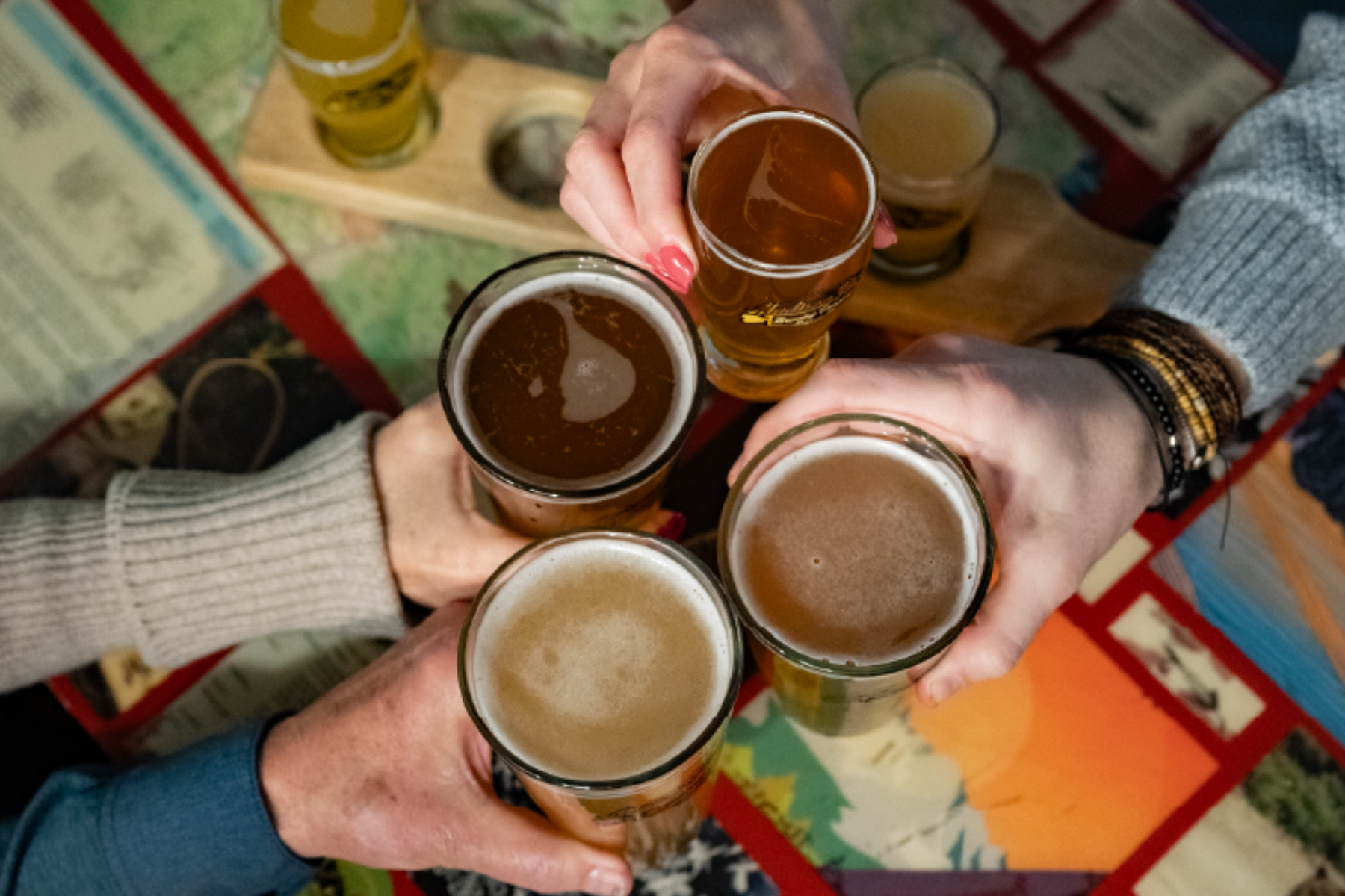 People doing cheers with their beers