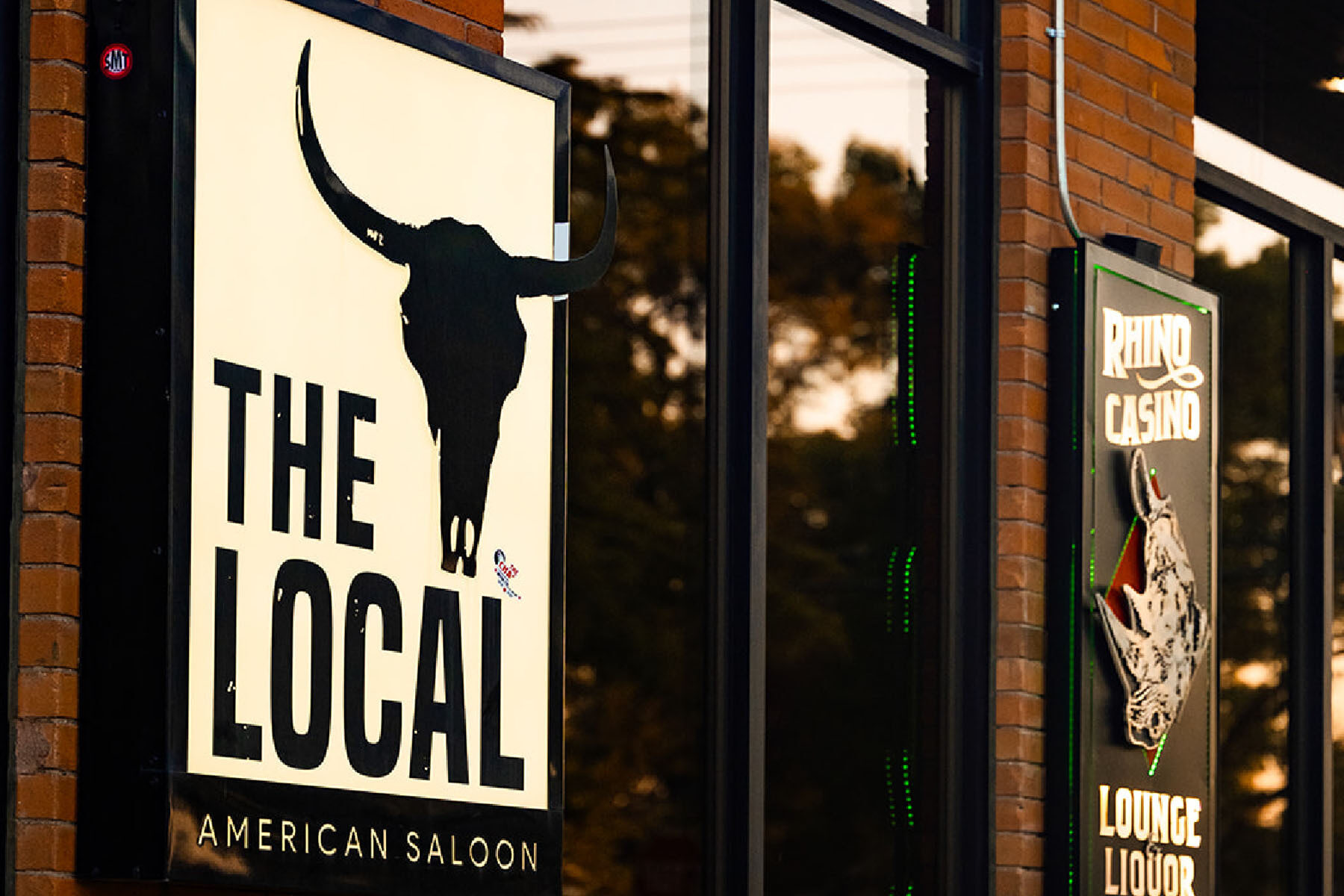 Sign for the The Local American Saloon in Belgrade, MT