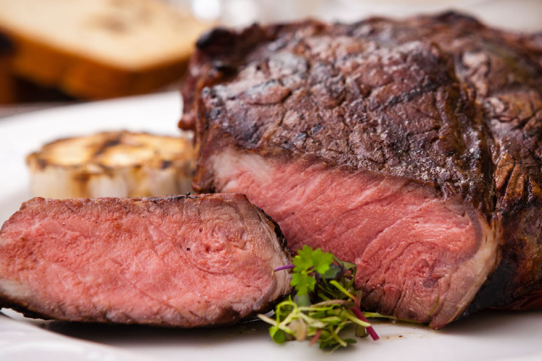 Sliced steak, garnished on a plate